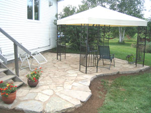 Whether you are seeking sun or shade, this limestone deck becomes part of the surrounding landscape